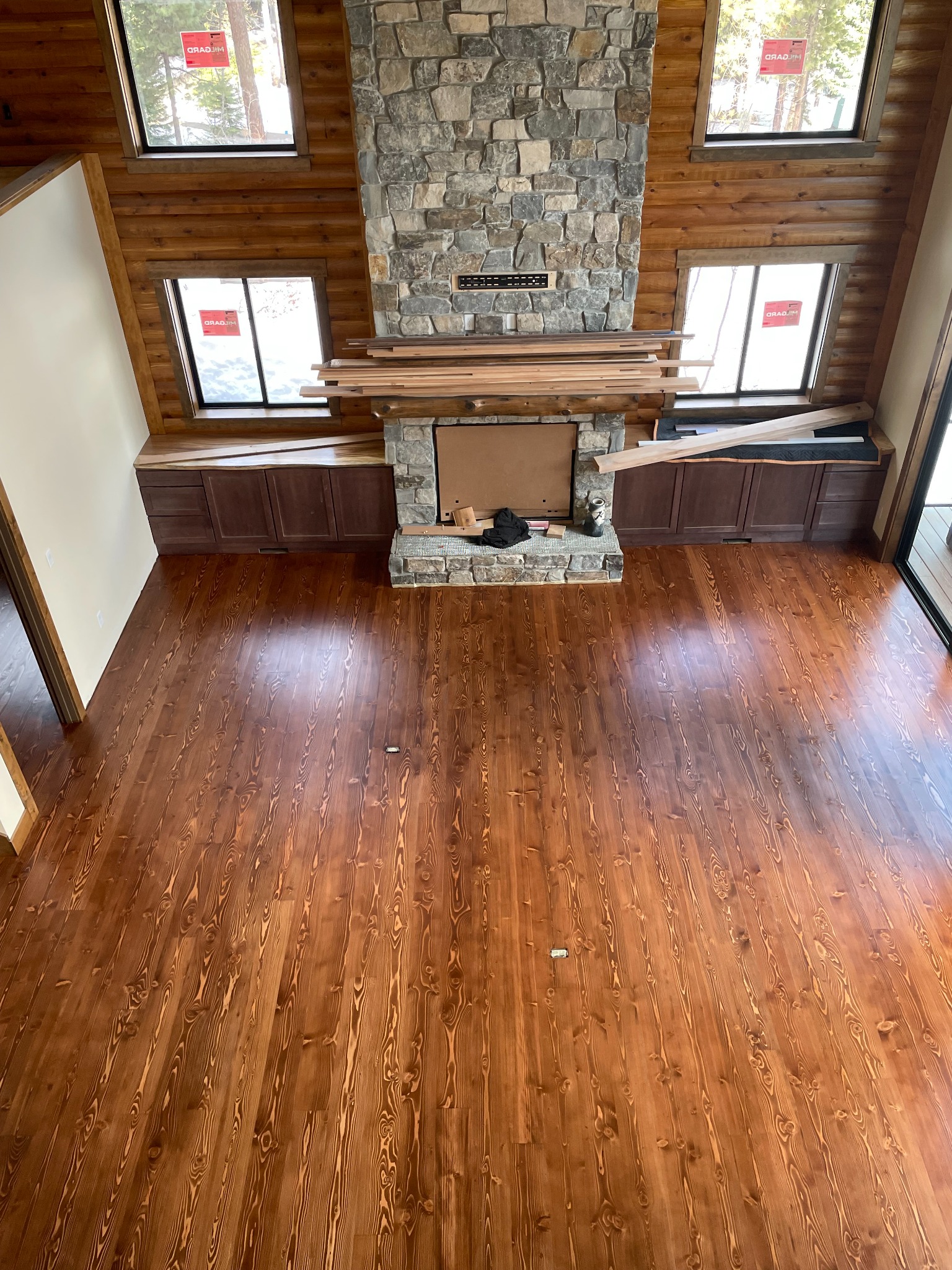 Cabin-style flooring with fireplace
